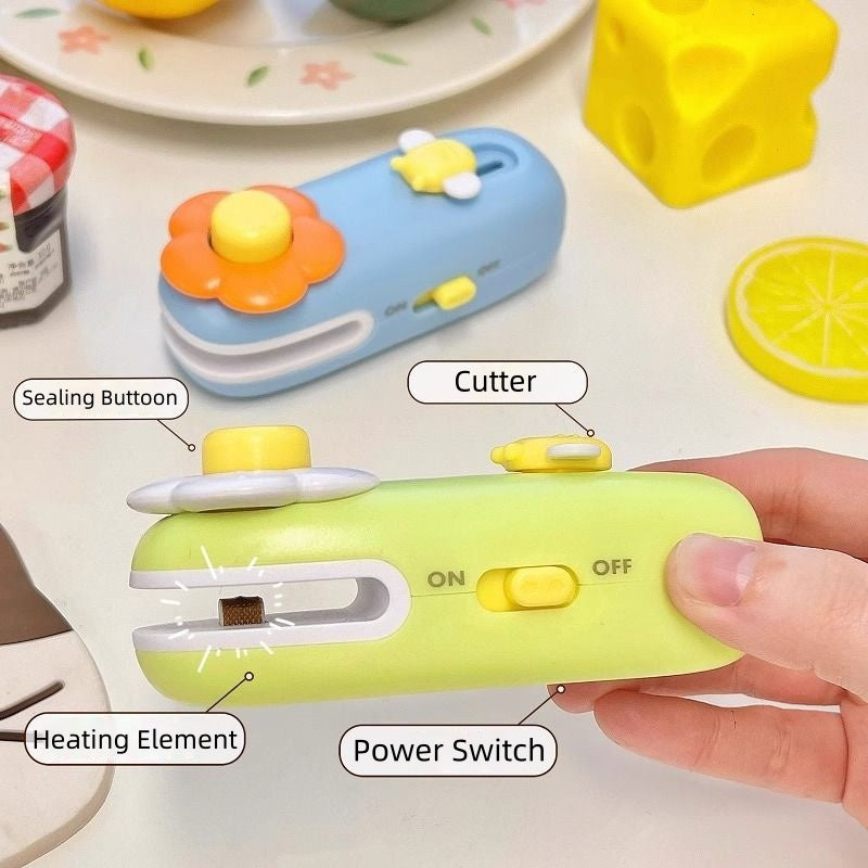 [DFC] Kitchen Home Use Magnetic Charging 2 in 1 Mini Flower Sealer Magnetic Charging Hand Press Snack Food Sealer with Cutter
